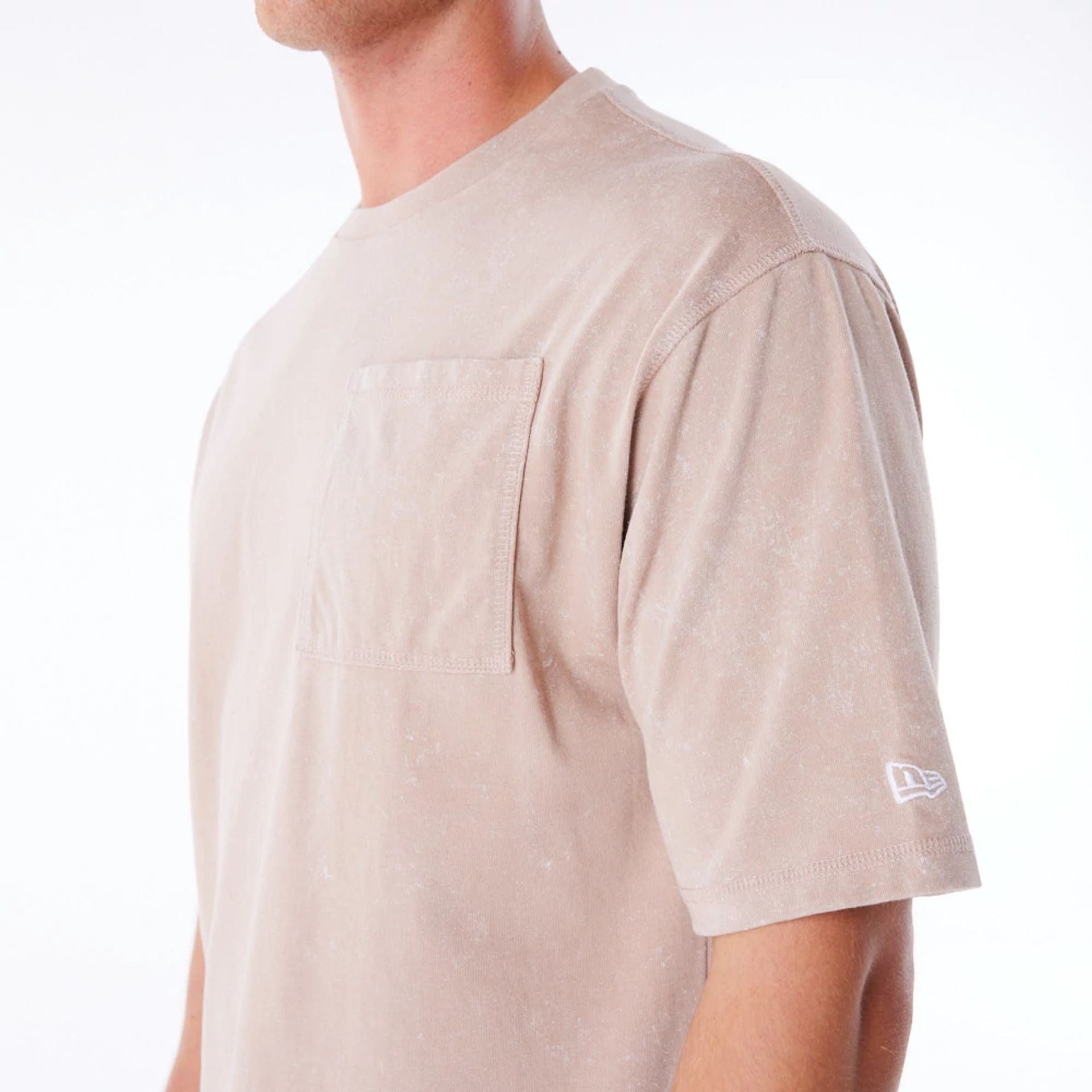 The Male model is wearing New Era Wash Beige Oversized T-Shirt 7