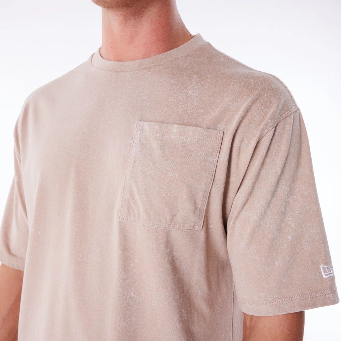 The Male model is wearing New Era Wash Beige Oversized T-Shirt 8