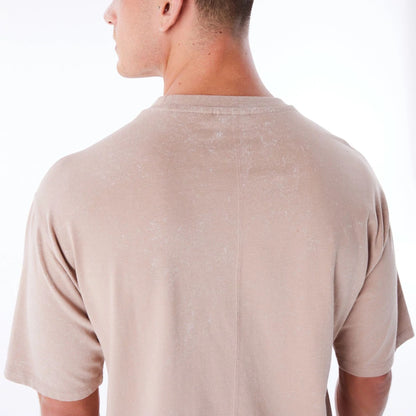 The Male model is wearing New Era Wash Beige Oversized T-Shirt 3