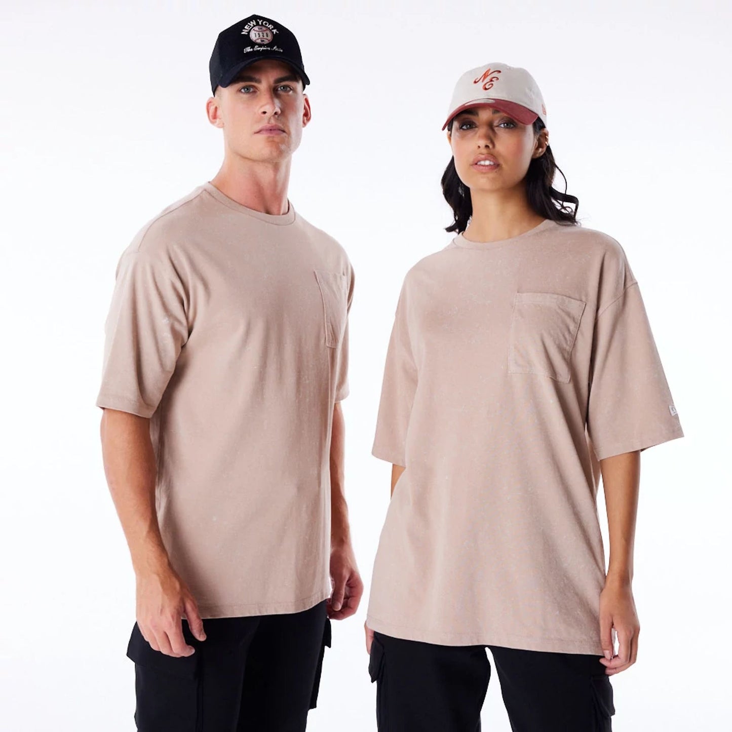 The Male model is wearing New Era Wash Beige Oversized T-Shirt 1