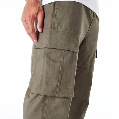 The Male model is wearing New Era Green Cargo Trousers 2