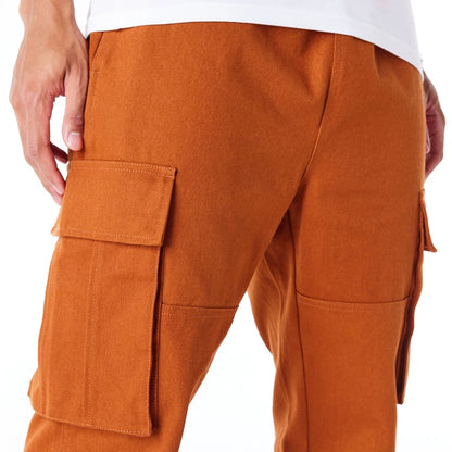 The Male model is wearing New Era Brown Cargo Trousers  2