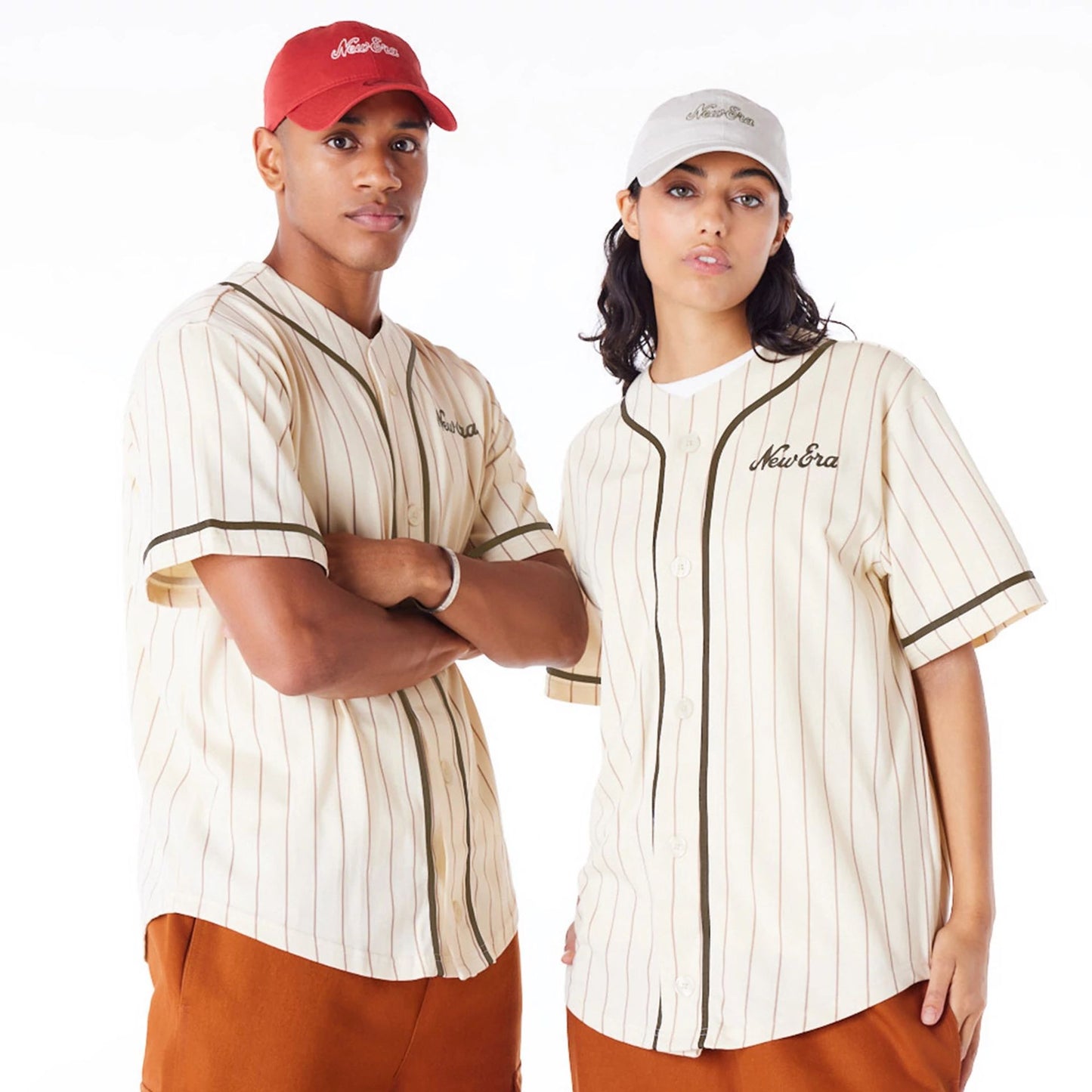 The Male model is wearing New Era Pinstripe Light Beige T-Shirt 1