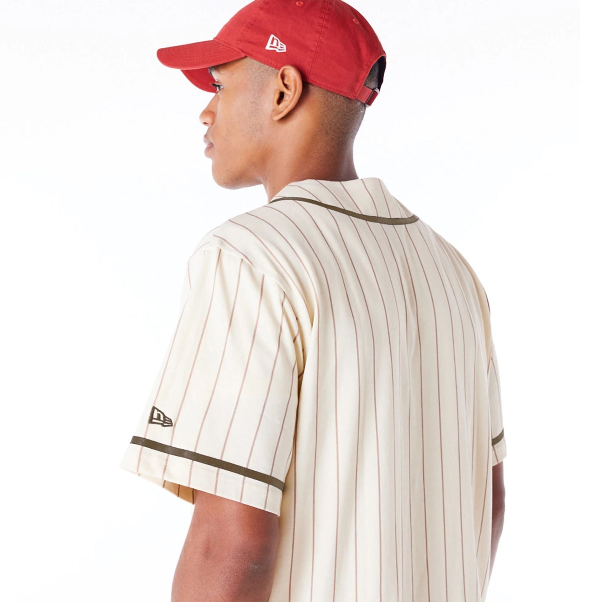 The Male model is wearing New Era Pinstripe Light Beige T-Shirt 6