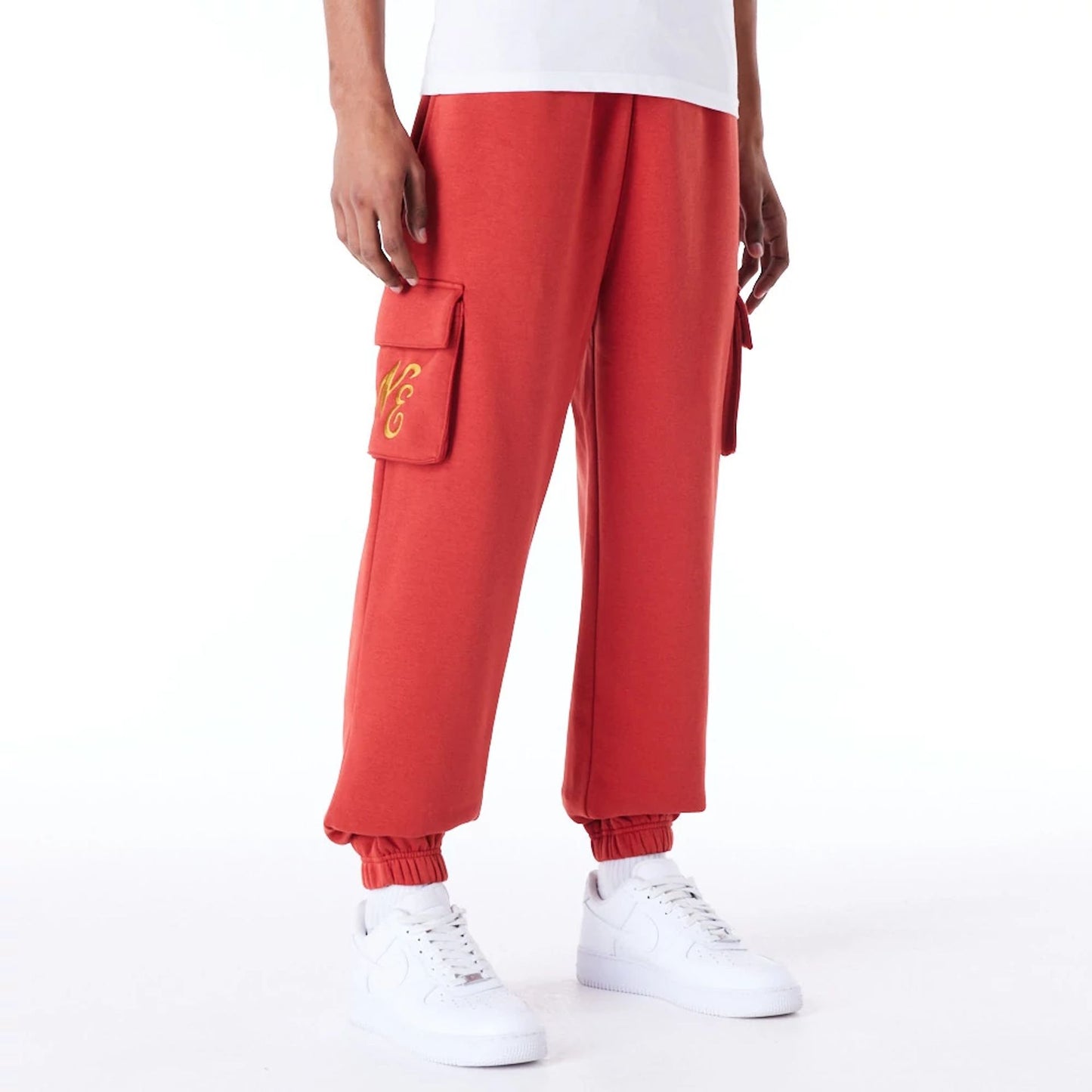 The Male model is wearing New Era Script Red Fleece Cargo Joggers 1