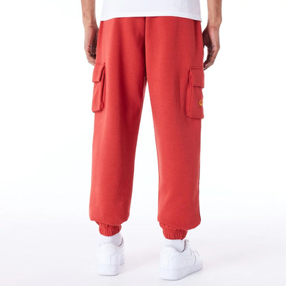 The Male model is wearing New Era Script Red Fleece Cargo Joggers 2