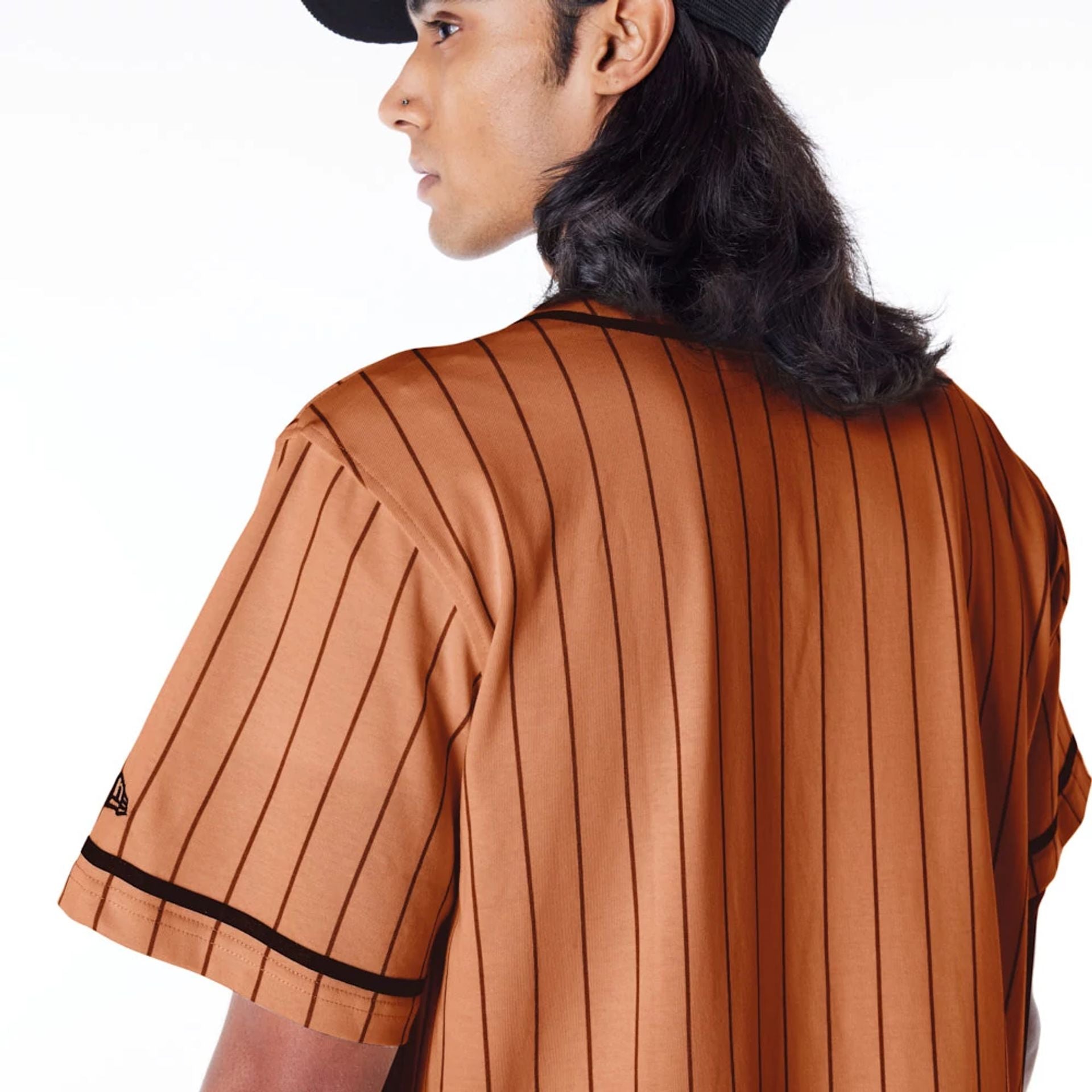 The Male model is wearing New Era Pinstripe Brown T-Shirt 4