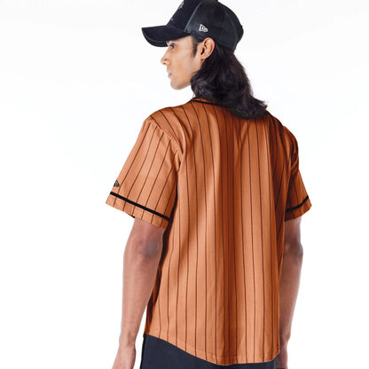 The Male model is wearing New Era Pinstripe Brown T-Shirt 6