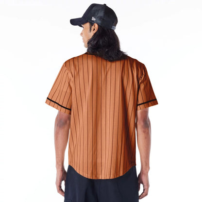 The Male model is wearing New Era Pinstripe Brown T-Shirt 7