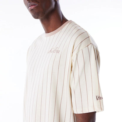 The Male model is wearing New Era Pinstripe Stone Oversized T-Shirt 3