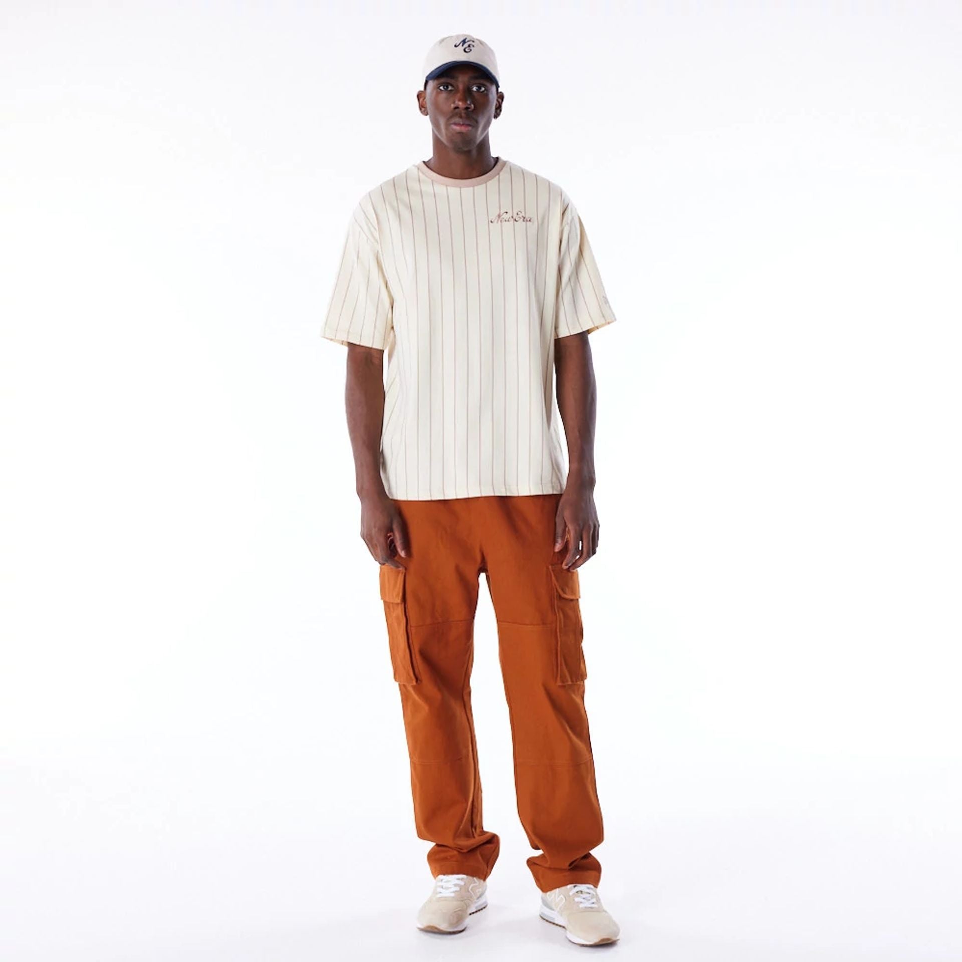 The Male model is wearing New Era Pinstripe Stone Oversized T-Shirt 6