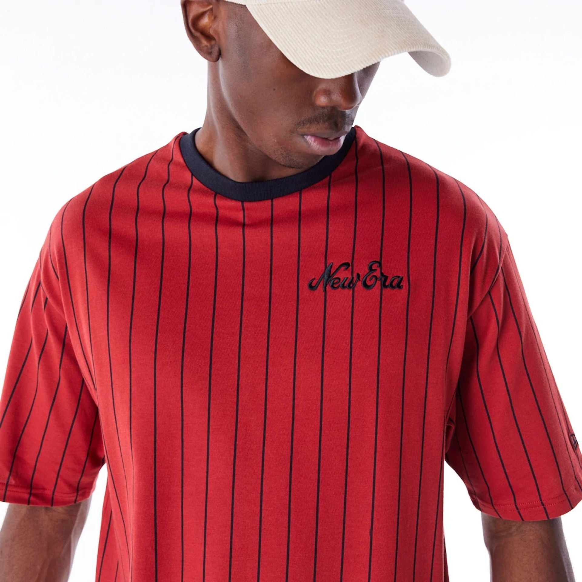 The Male model is wearing New Era Pinstripe Red Oversized T-Shirt 2