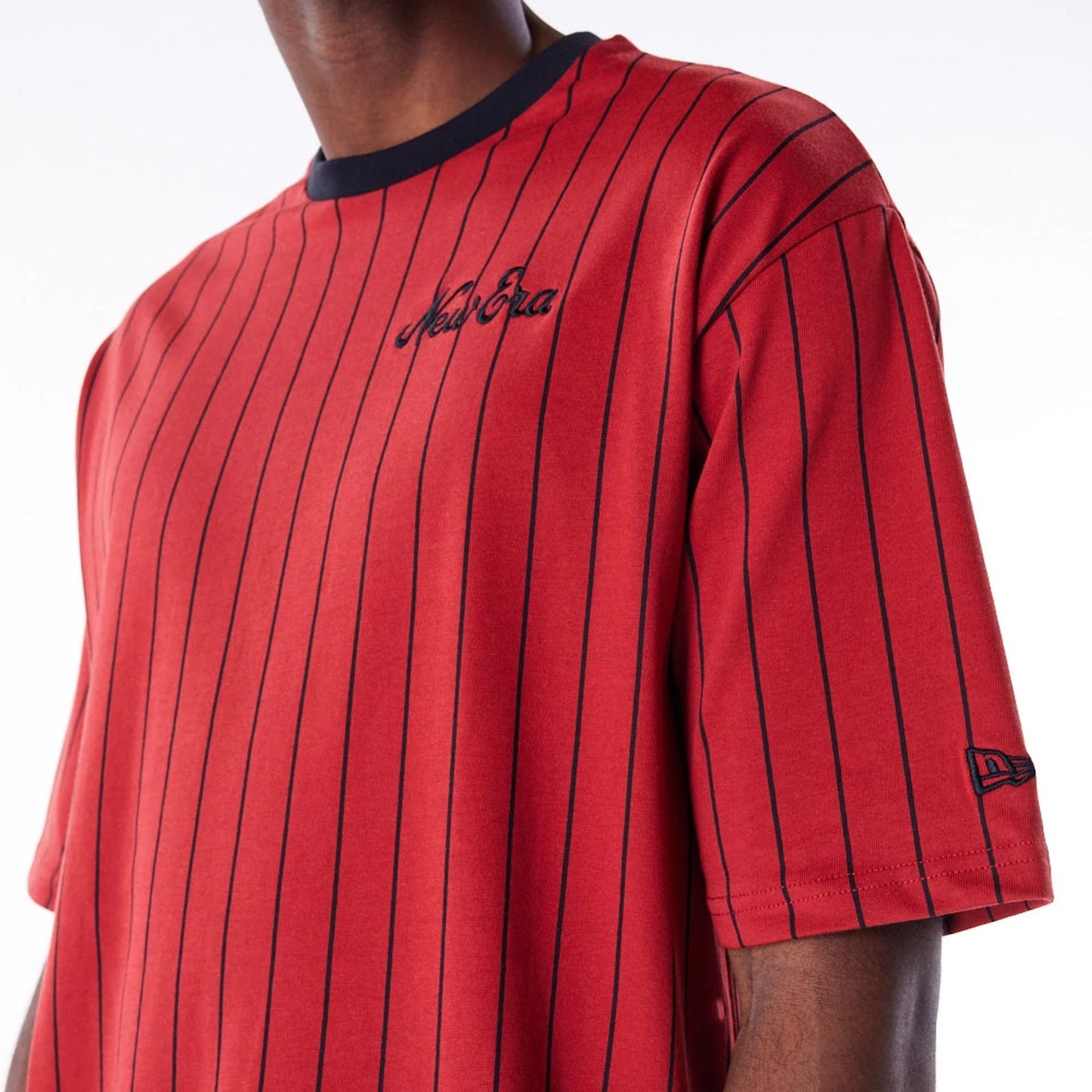 The Male model is wearing New Era Pinstripe Red Oversized T-Shirt 3