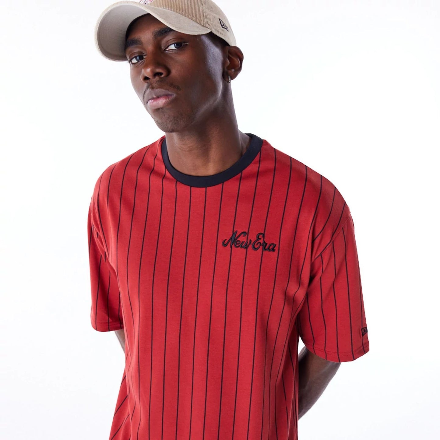 The Male model is wearing New Era Pinstripe Red Oversized T-Shirt 5