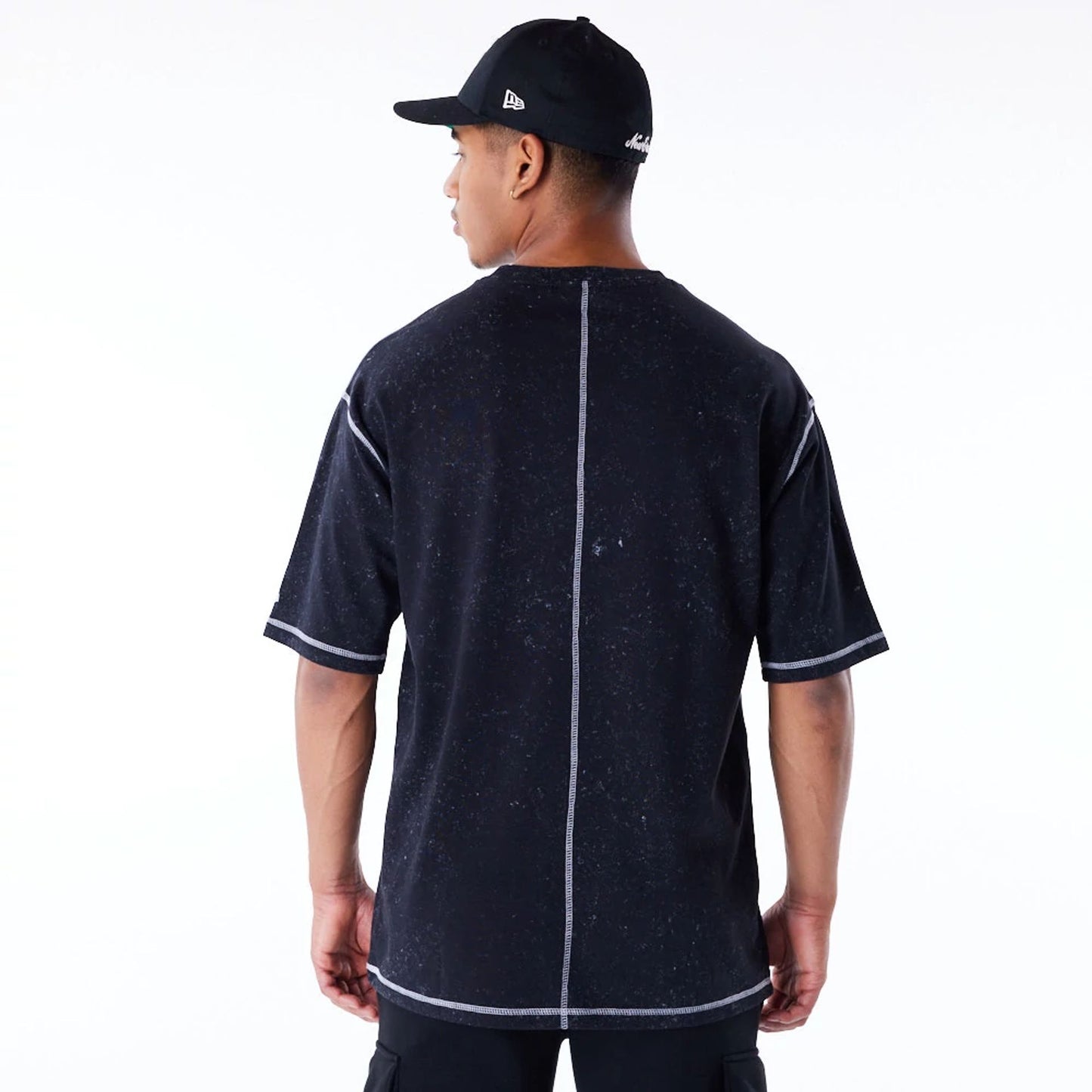 The Male model is wearing New Era Wash Black Oversized T-Shirt 4