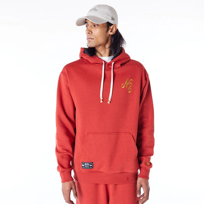 The Male model is wearing New Era Script Logo Red Oversized Pullover Hoodie 1