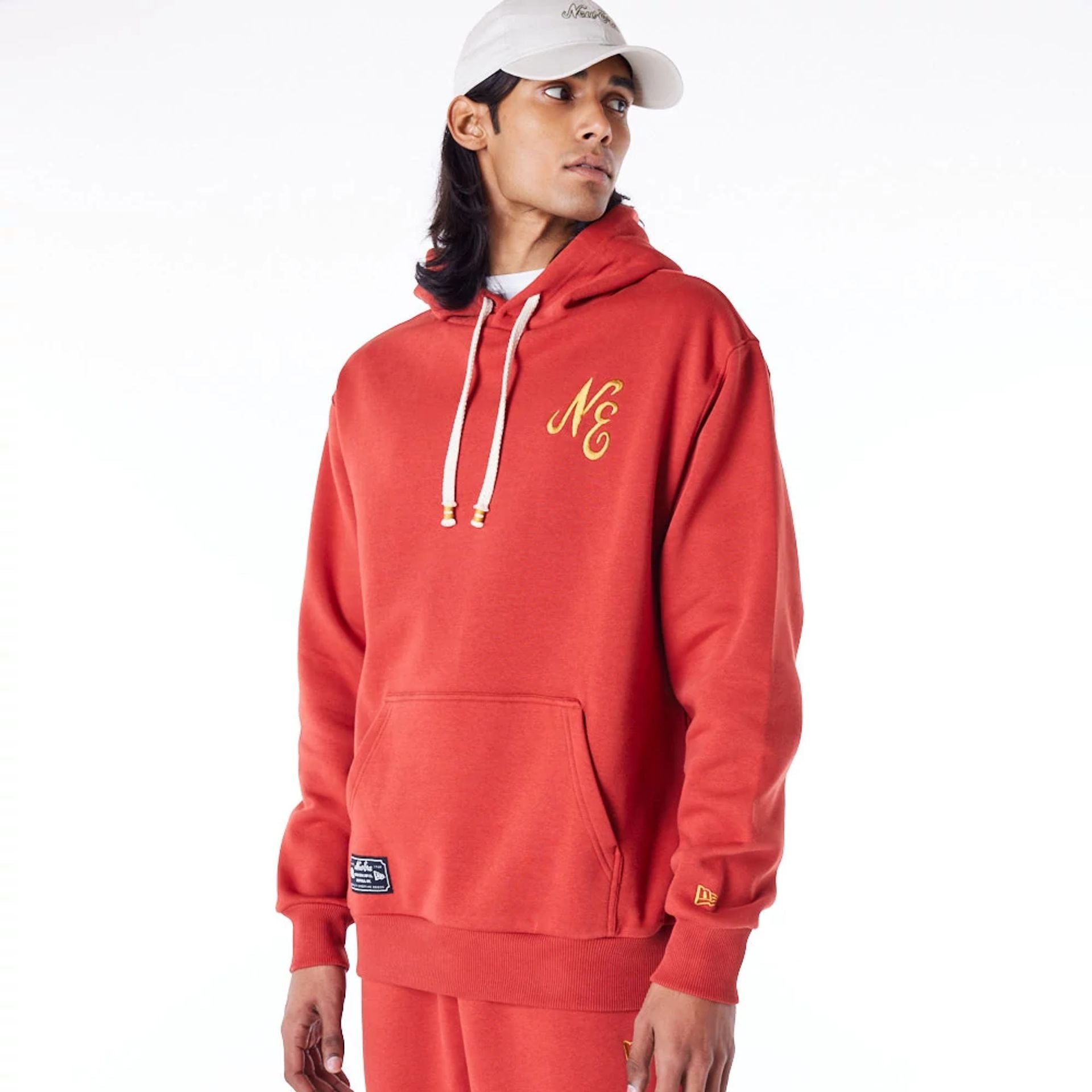 The Male model is wearing New Era Script Logo Red Oversized Pullover Hoodie 8