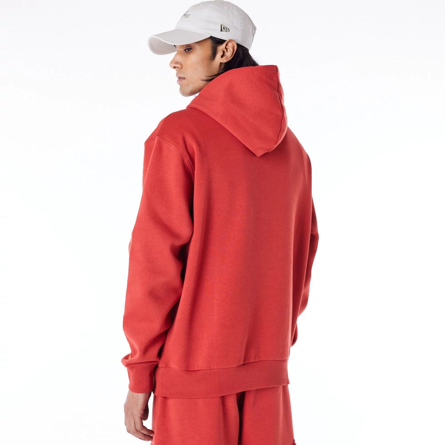 The Male model is wearing New Era Script Logo Red Oversized Pullover Hoodie 4