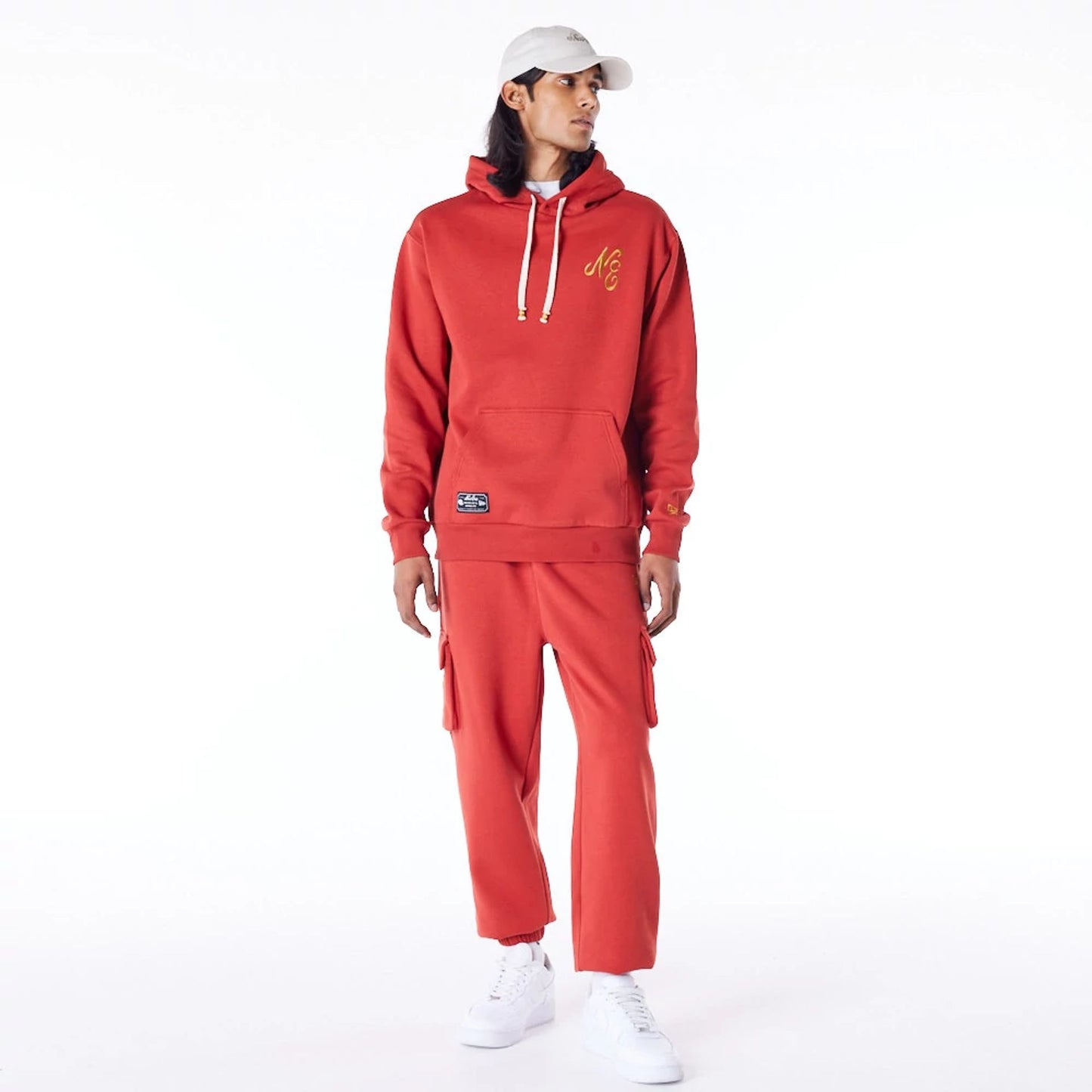 The Male model is wearing New Era Script Logo Red Oversized Pullover Hoodie 3