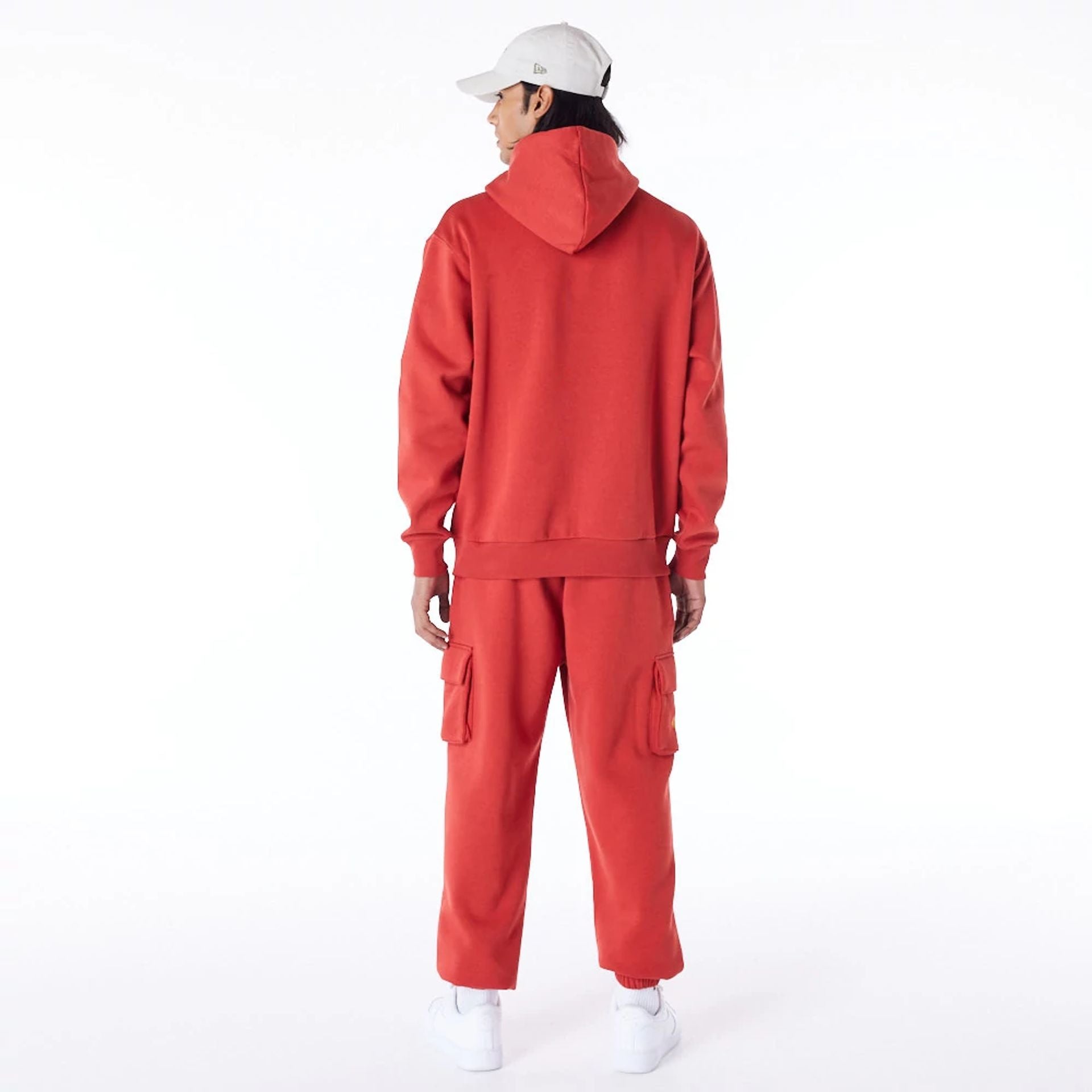 The Male model is wearing New Era Script Logo Red Oversized Pullover Hoodie 2