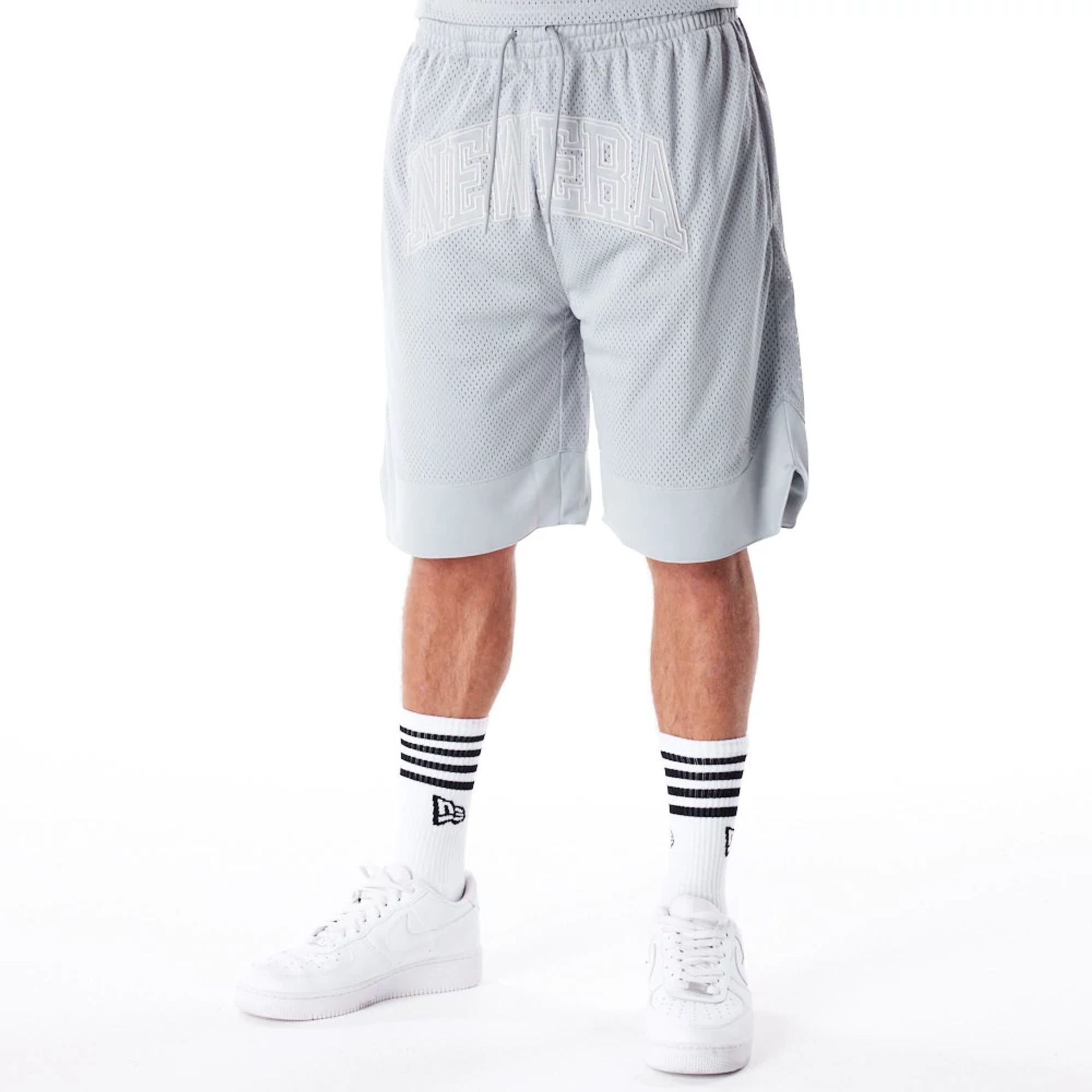 The Male model is wearing New Era Mesh Grey Oversized Shorts 1