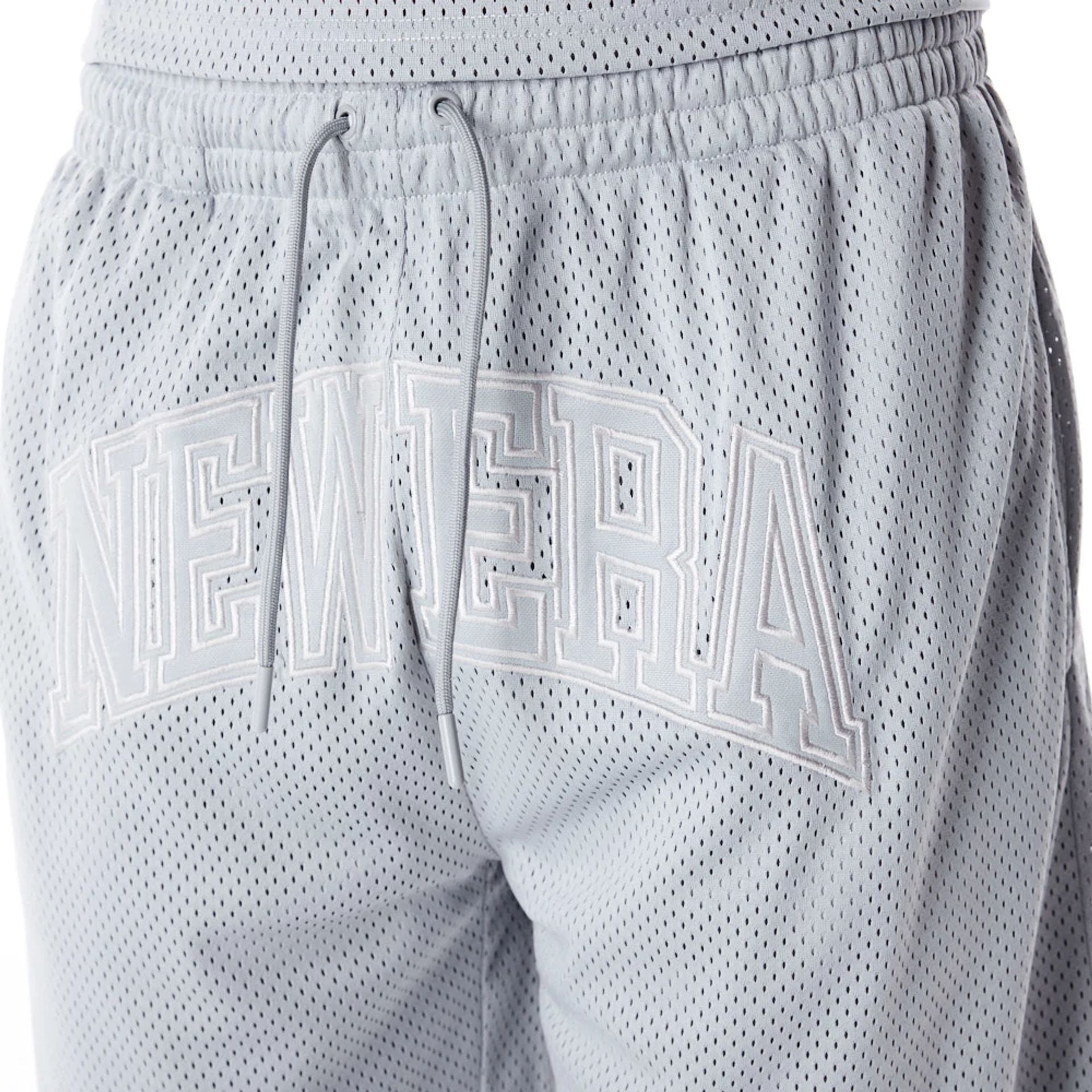 The Male model is wearing New Era Mesh Grey Oversized Shorts 4