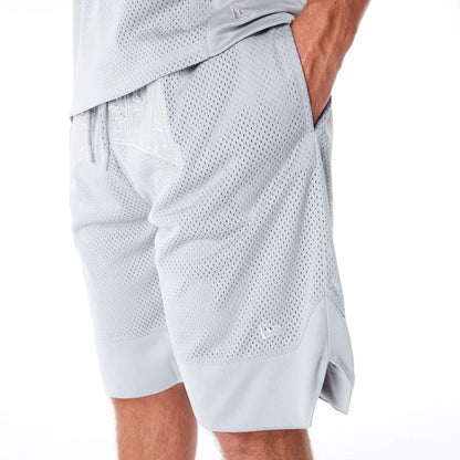 The Male model is wearing New Era Mesh Grey Oversized Shorts 5