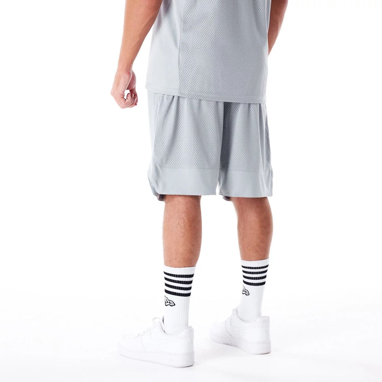 The Male model is wearing New Era Mesh Grey Oversized Shorts 6