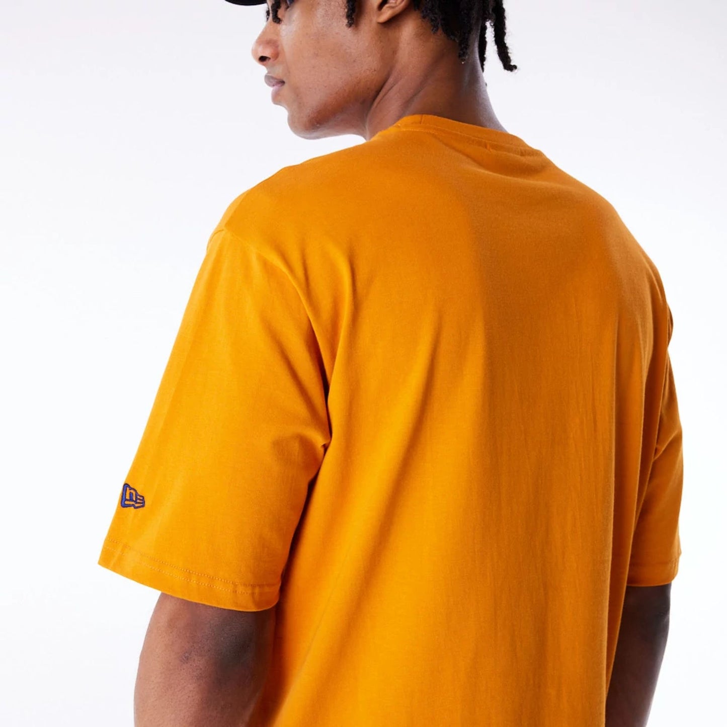 The Male model is wearing New Era Font Graphic Orange Oversized T-Shirt 5