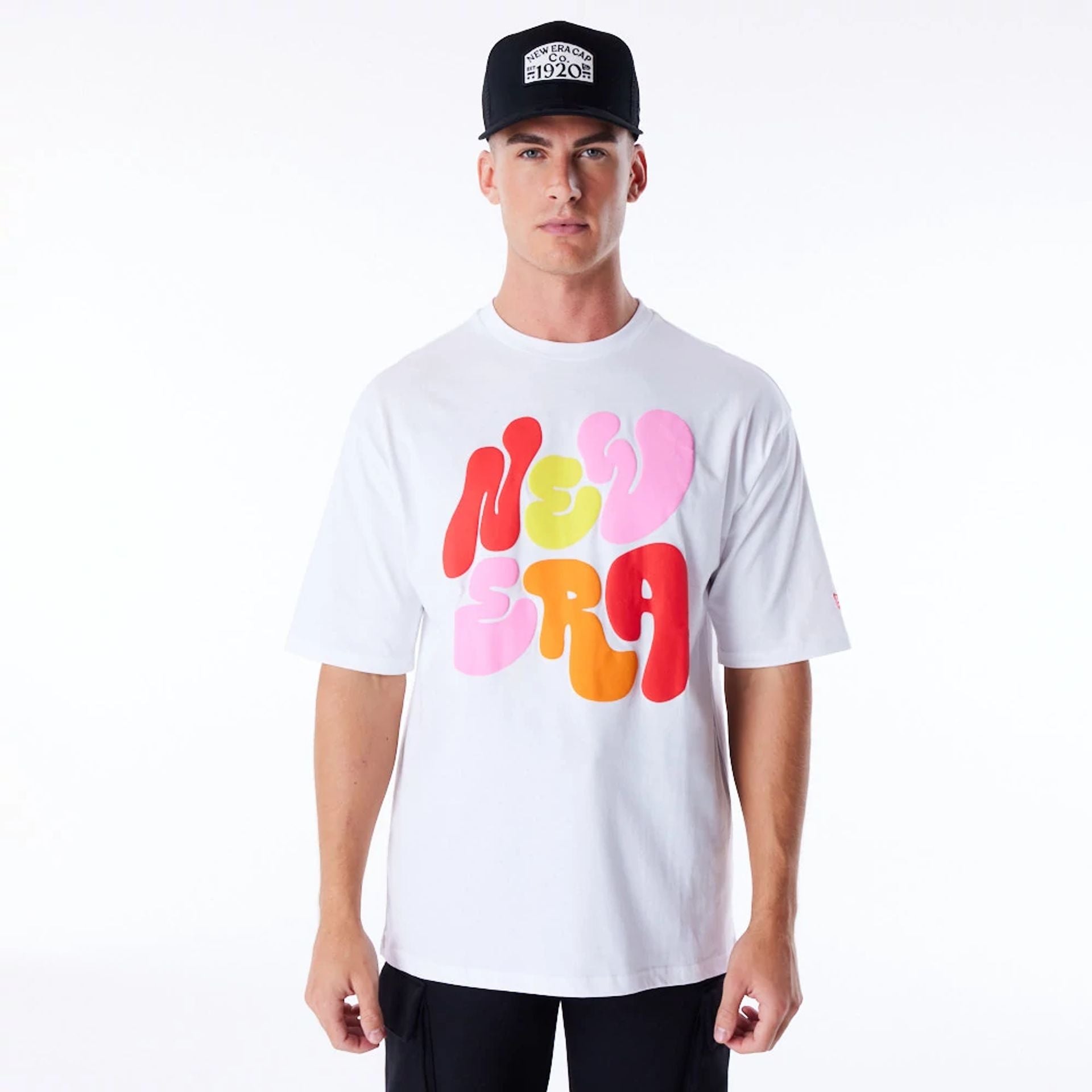 The Male model is wearing New Era Font Graphic White Oversized T-Shirt 1