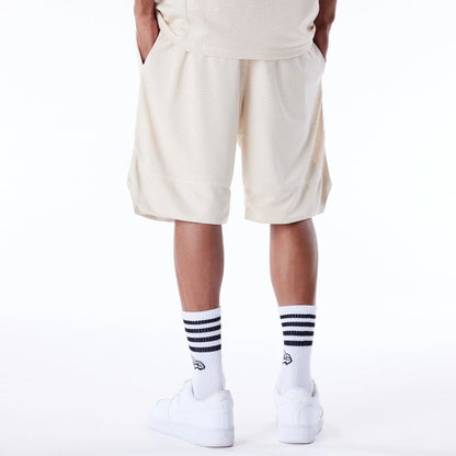 The Male model is wearing New Era Mesh Stone Oversized Shorts 6