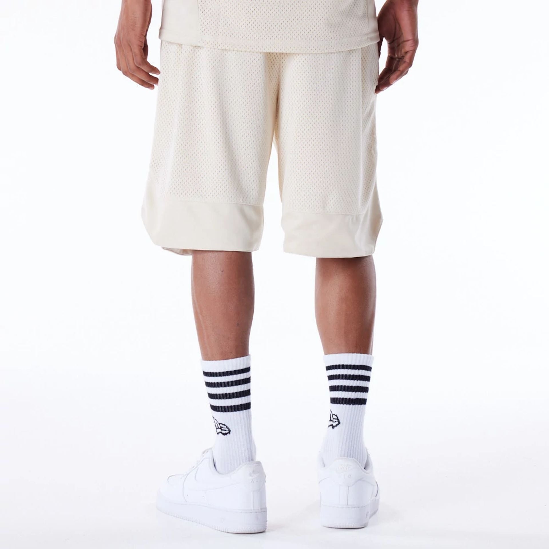 The Male model is wearing New Era Mesh Stone Oversized Shorts 7