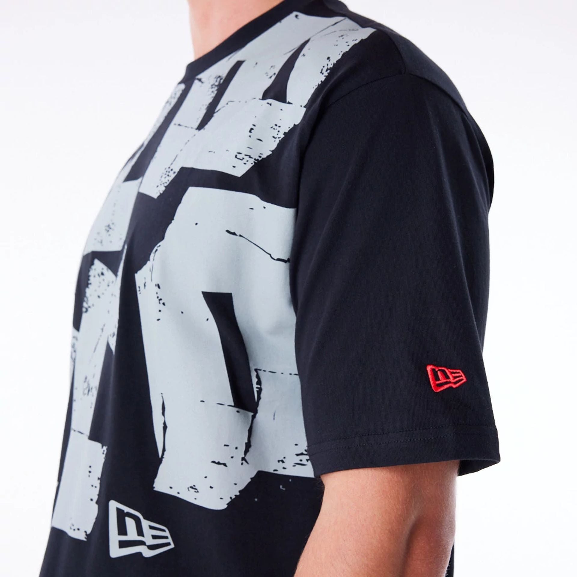 The Male model is wearing New Era Font Graphic Black Oversized T-Shirt 2