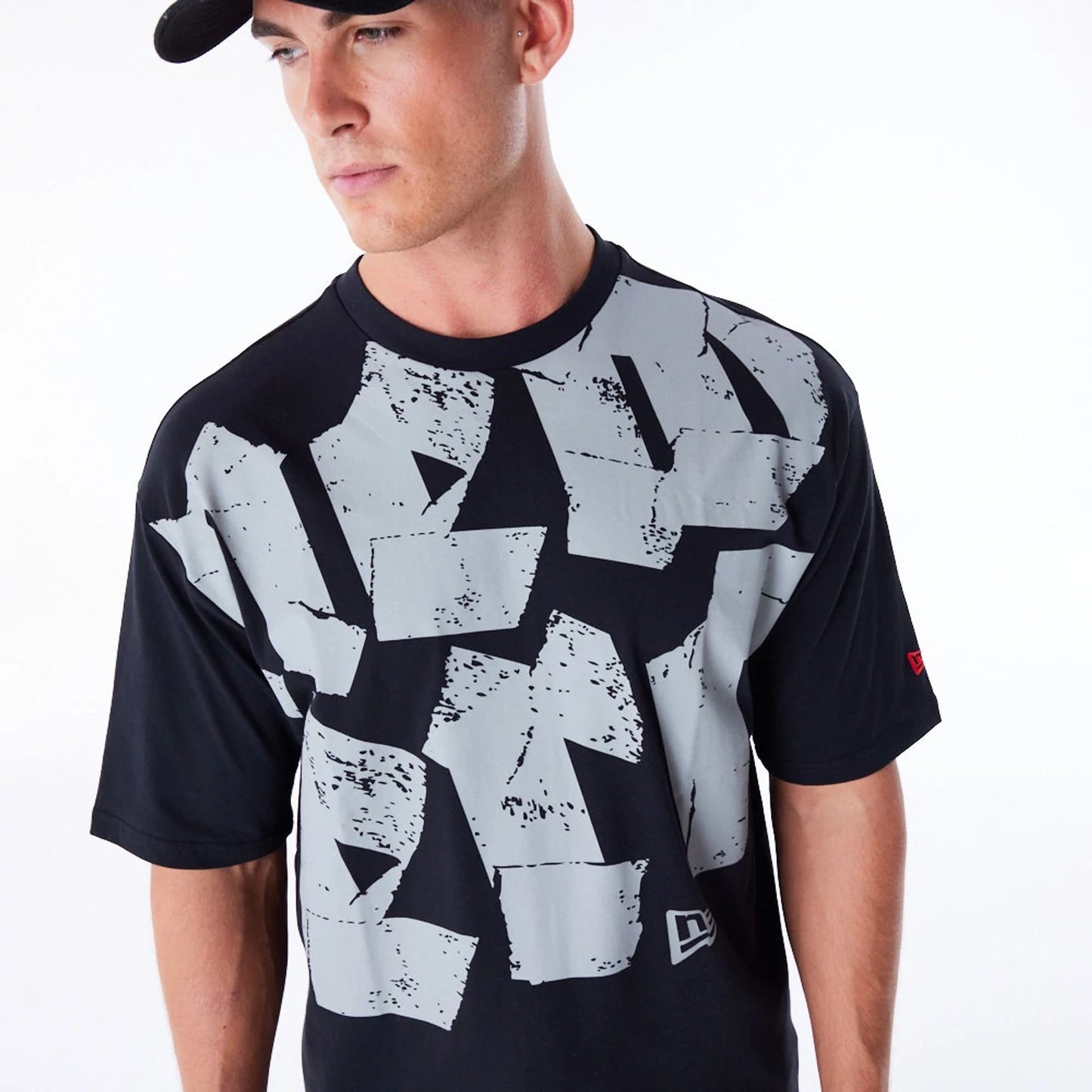 The Male model is wearing New Era Font Graphic Black Oversized T-Shirt 3