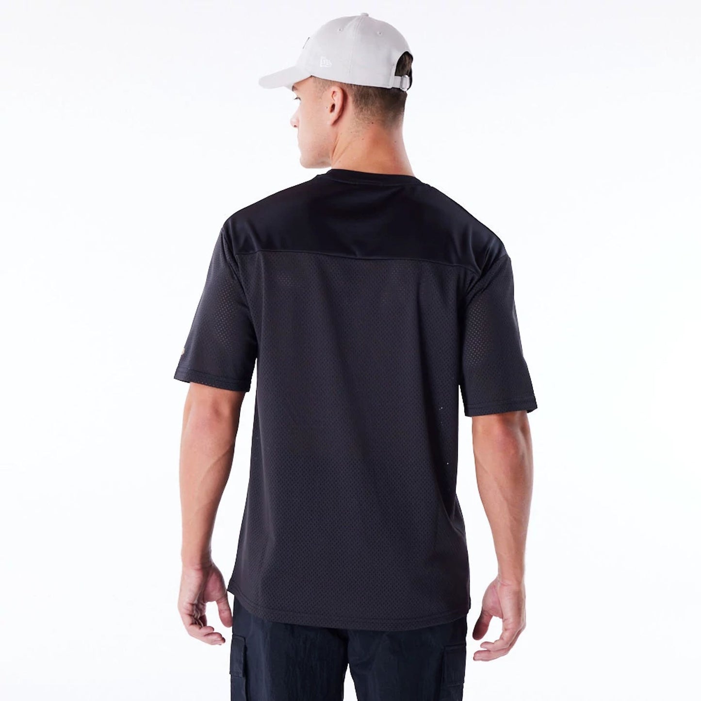 The Male model is wearing New Era Mesh Black Jersey 5