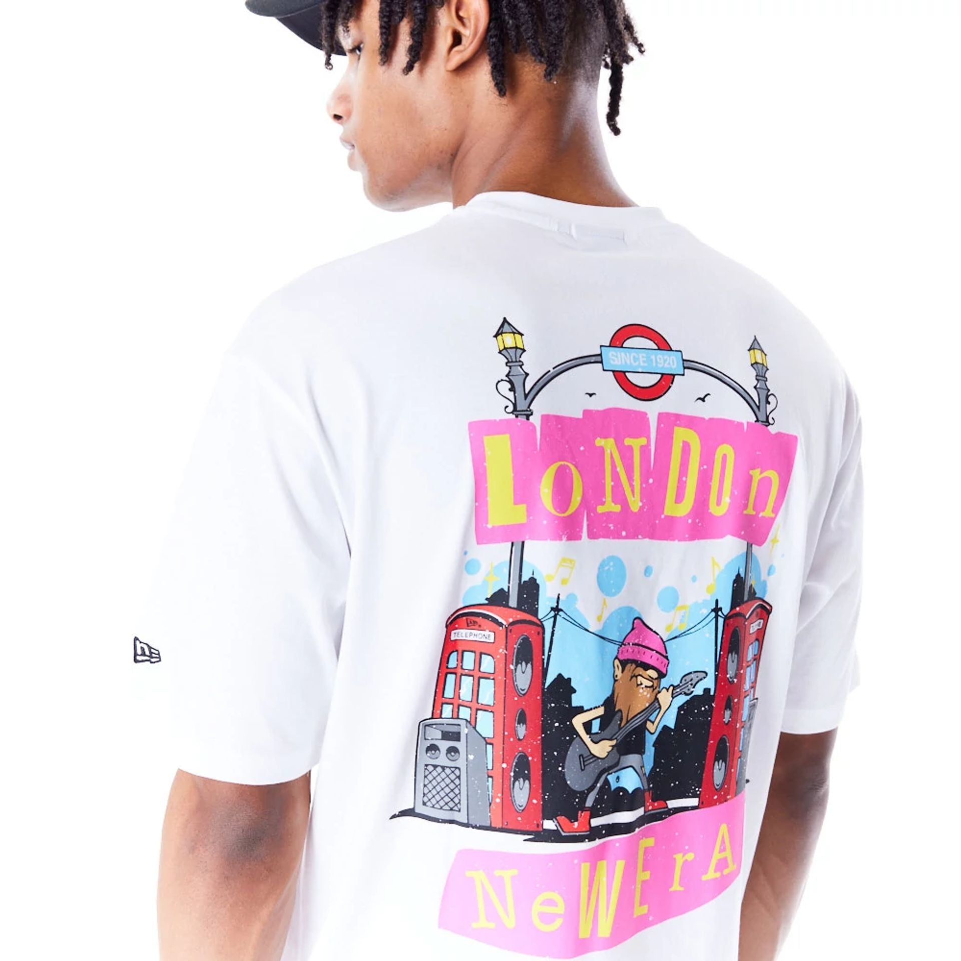 The Male model is wearing New Era Location Graphic London White Oversized T-Shirt 5