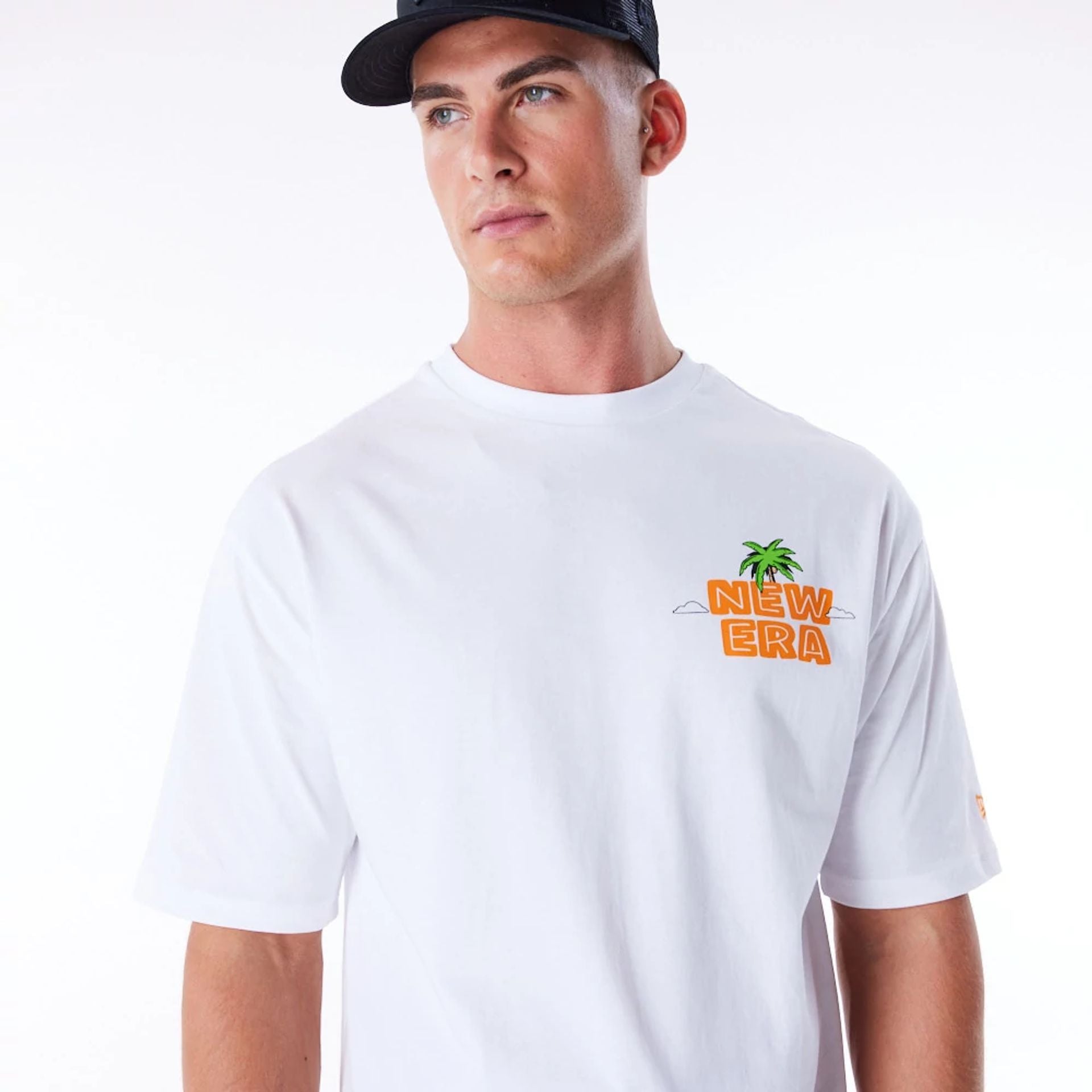 The Male model is wearing New Era Los Angeles City Graphic White Oversized T-Shirt 6