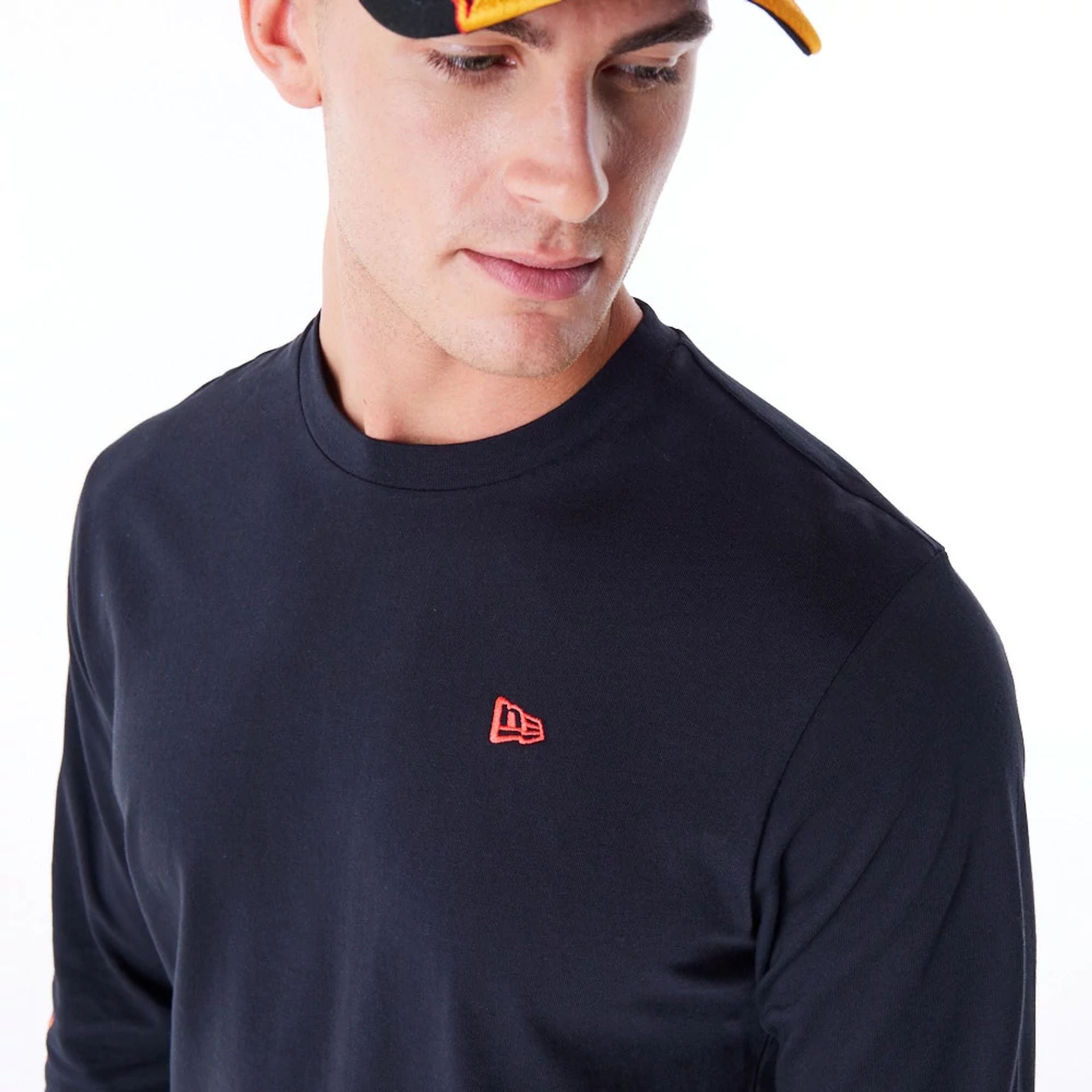 The Male model is wearing New Era Flag Flame Black Long Sleeve T-Shirt 2