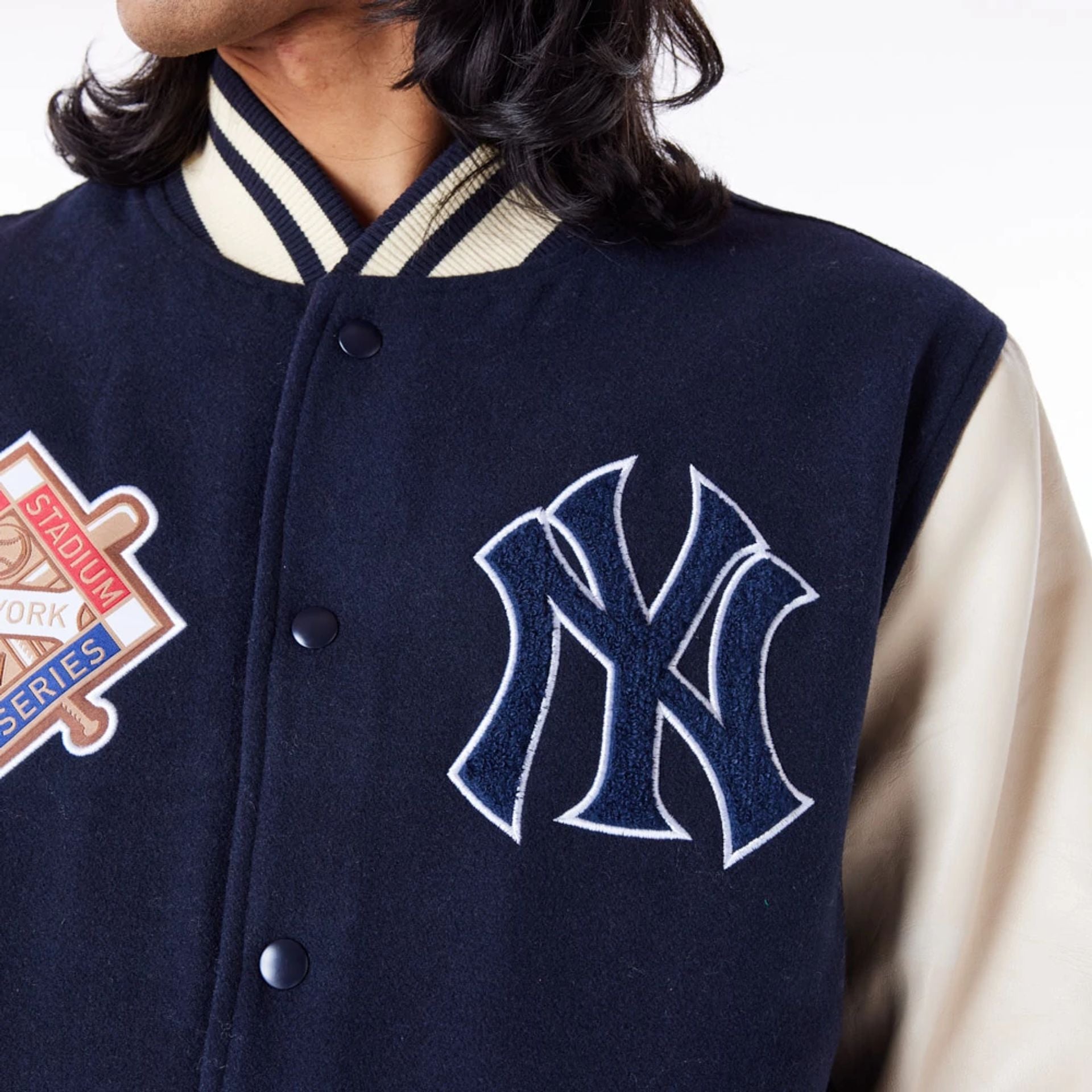 The Male model is wearing New York Yankees MLB Patch Navy Varsity Jacket 4