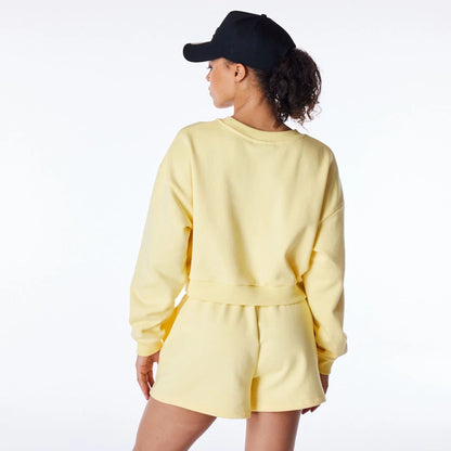 The Female model is wearing LA Dodgers Womens MLB League Essential Pastel Yellow Crop Crew Neck Sweatshirt 4