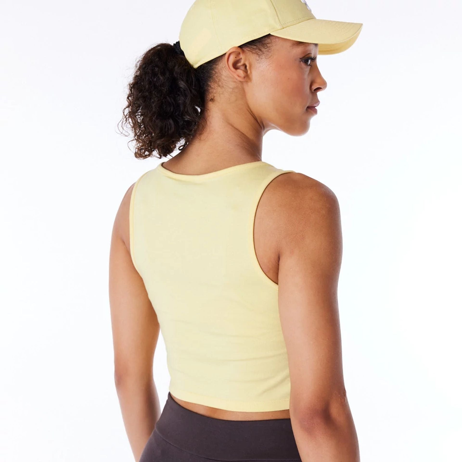 The Female model is wearing LA Dodgers Womens MLB League Essential Pastel Yellow Crop Tank Top 7