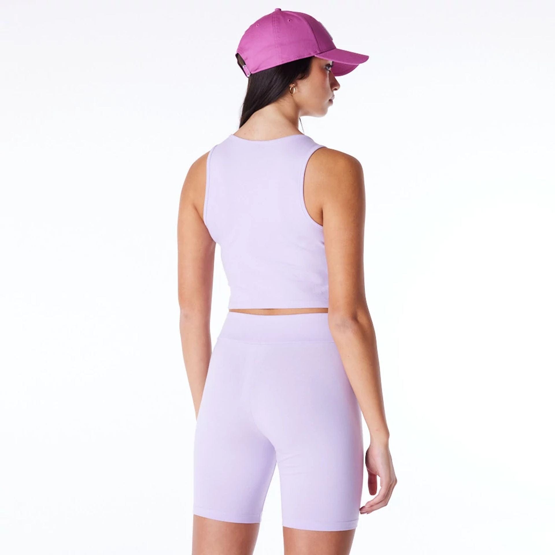 The Female model is wearing New York Yankees Womens MLB League Essential Pastel Purple Crop Tank Top 2