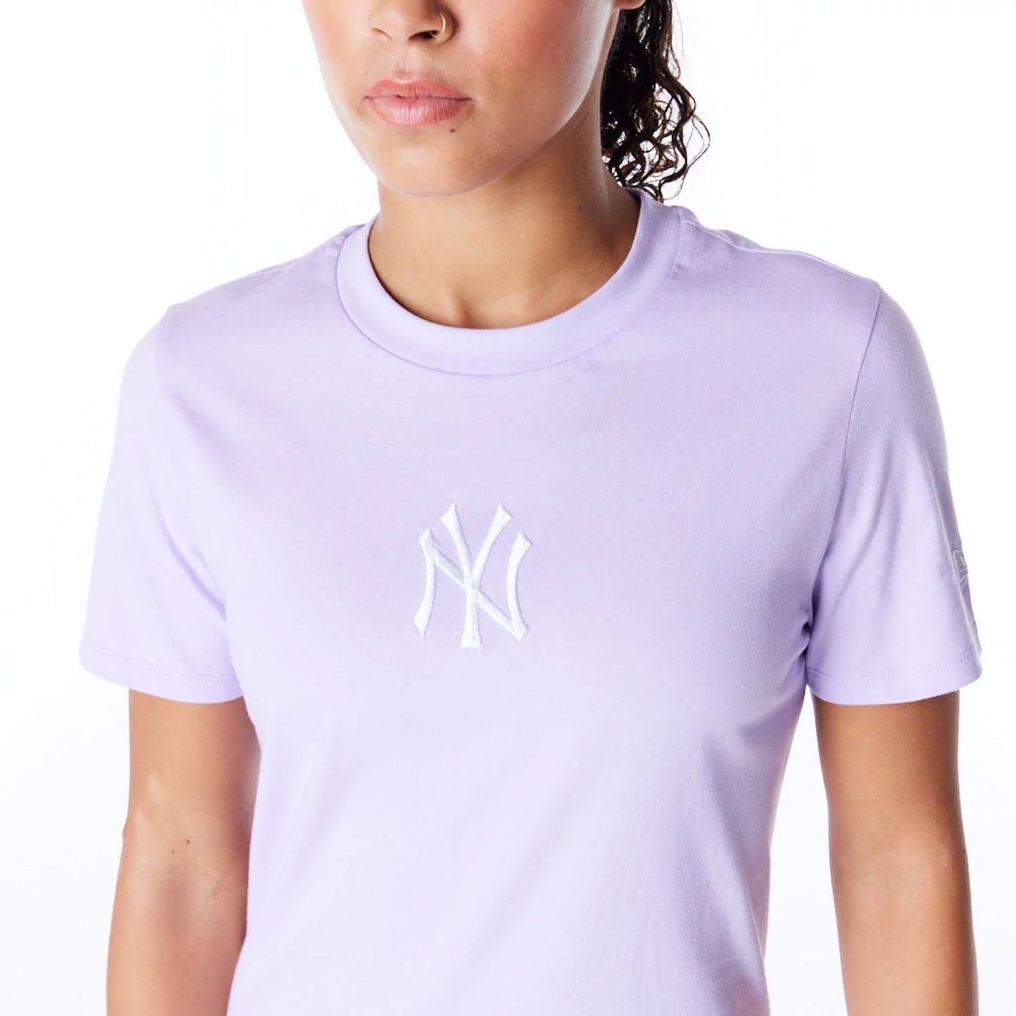 The Female model is wearing New York Yankees Womens MLB League Essential Pastel Purple T-Shirt 8