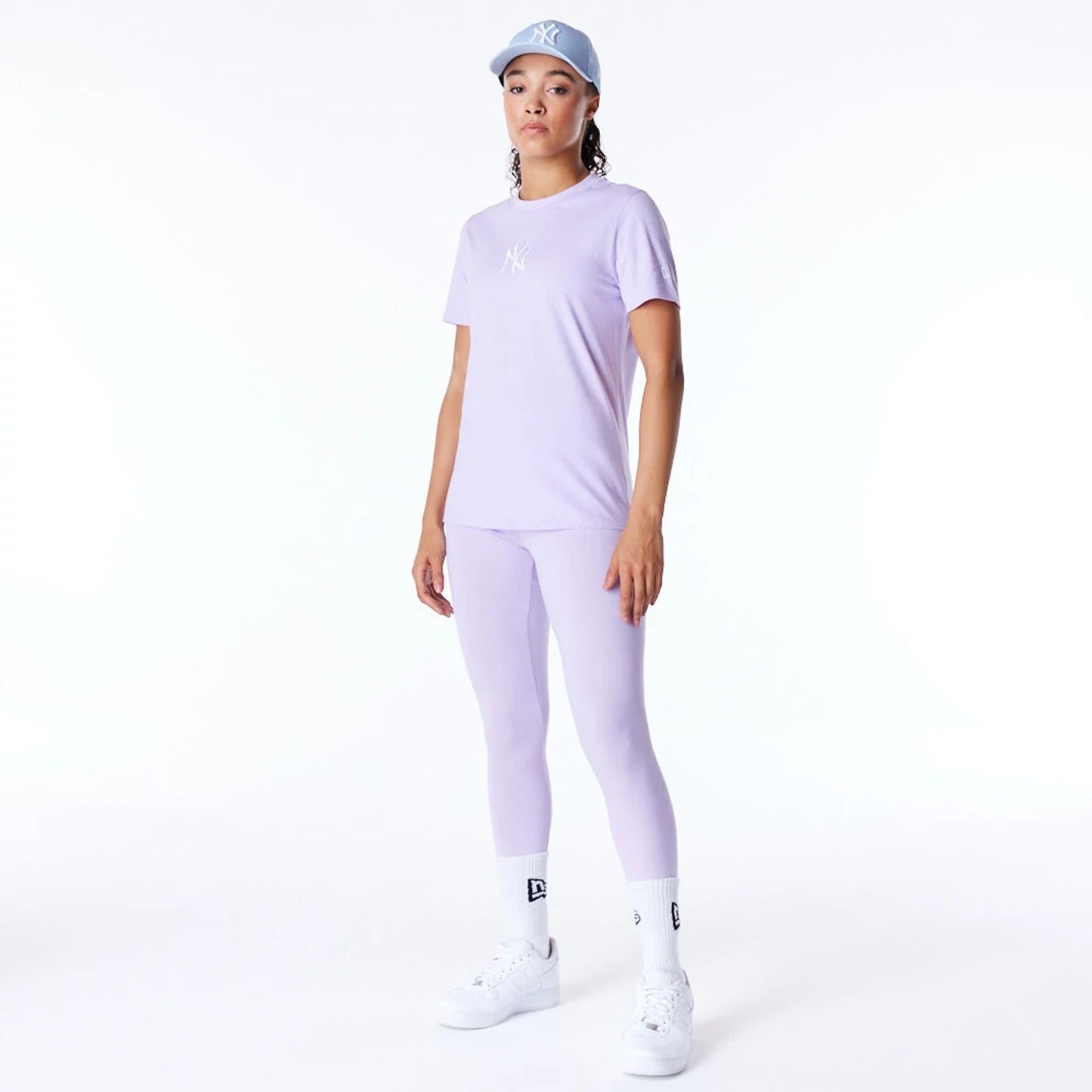 The Female model is wearing New York Yankees Womens MLB League Essential Pastel Purple T-Shirt 7