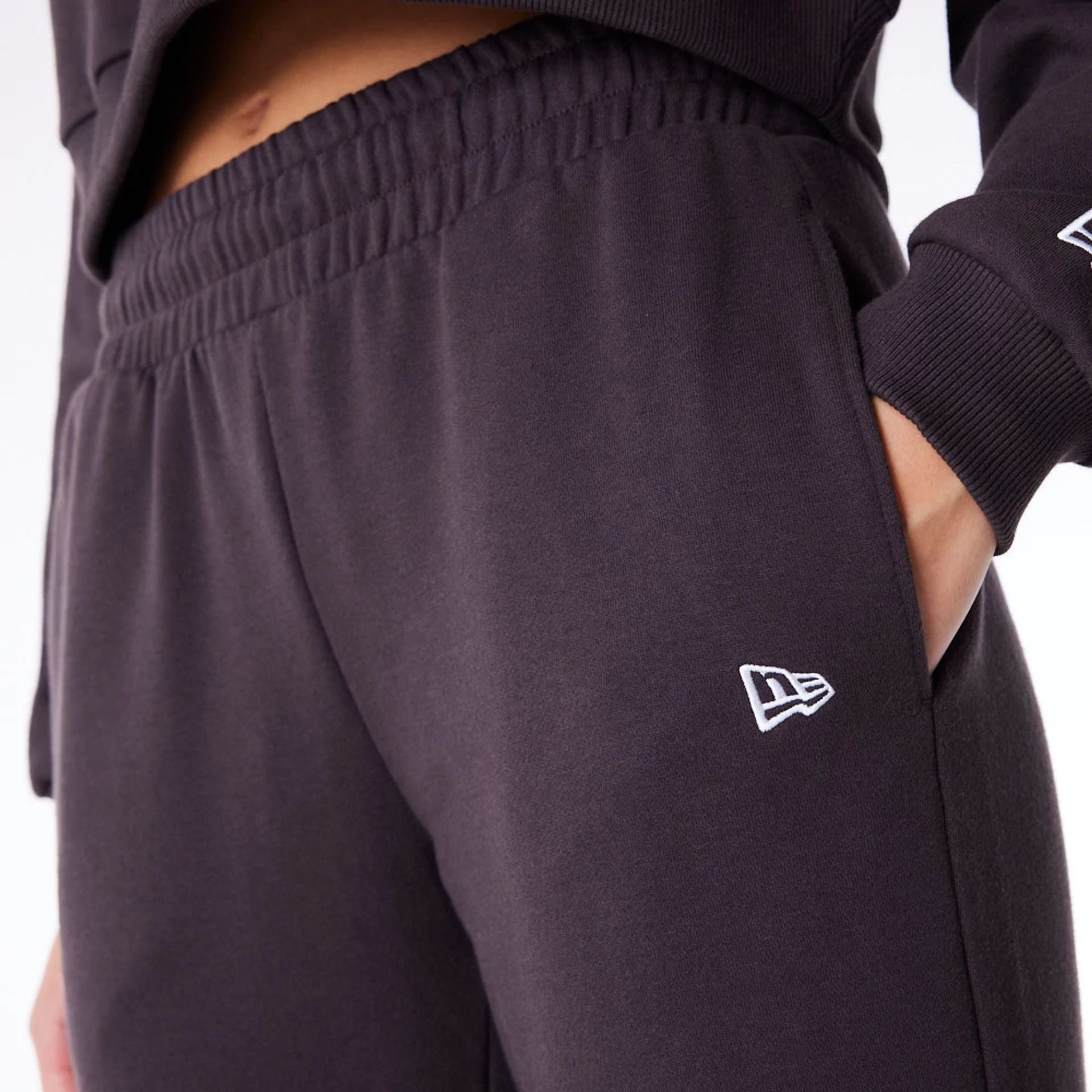 The Female model is wearing Detroit Tigers Womens MLB League Essential Dark Brown Fleece Joggers 8