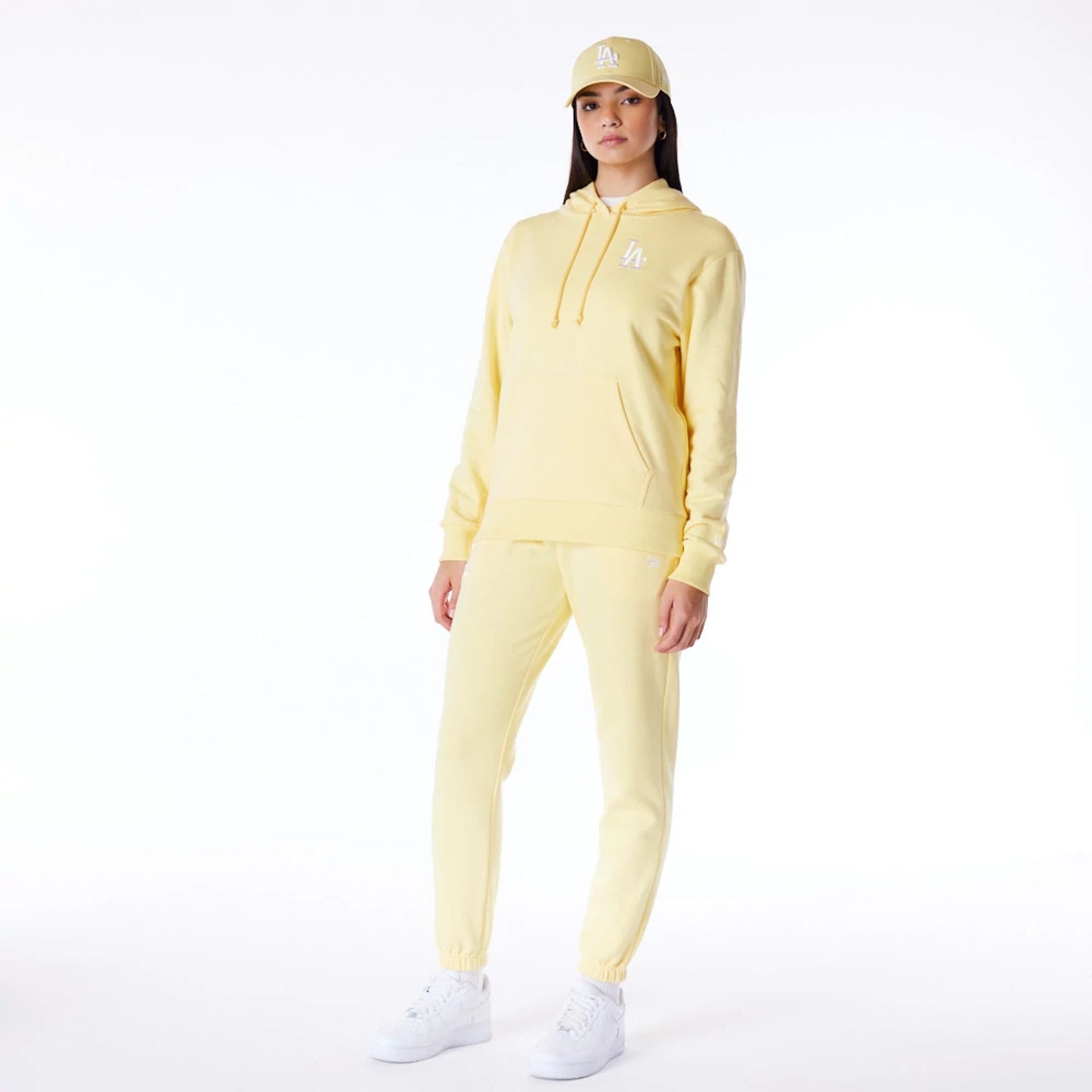 The Female model is wearing LA Dodgers Womens MLB League Essential Pastel Yellow Fleece Joggers 3