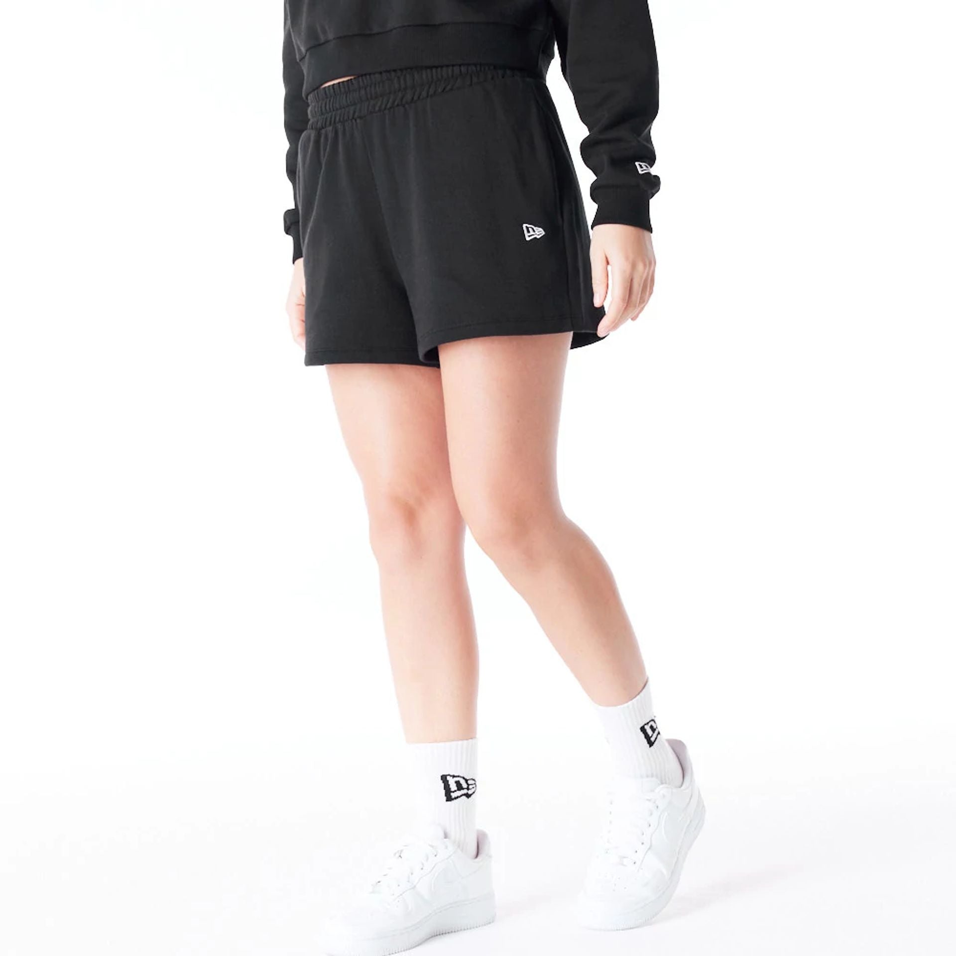 The Female model is wearing New York Yankees Womens MLB League Essential Black Shorts 3