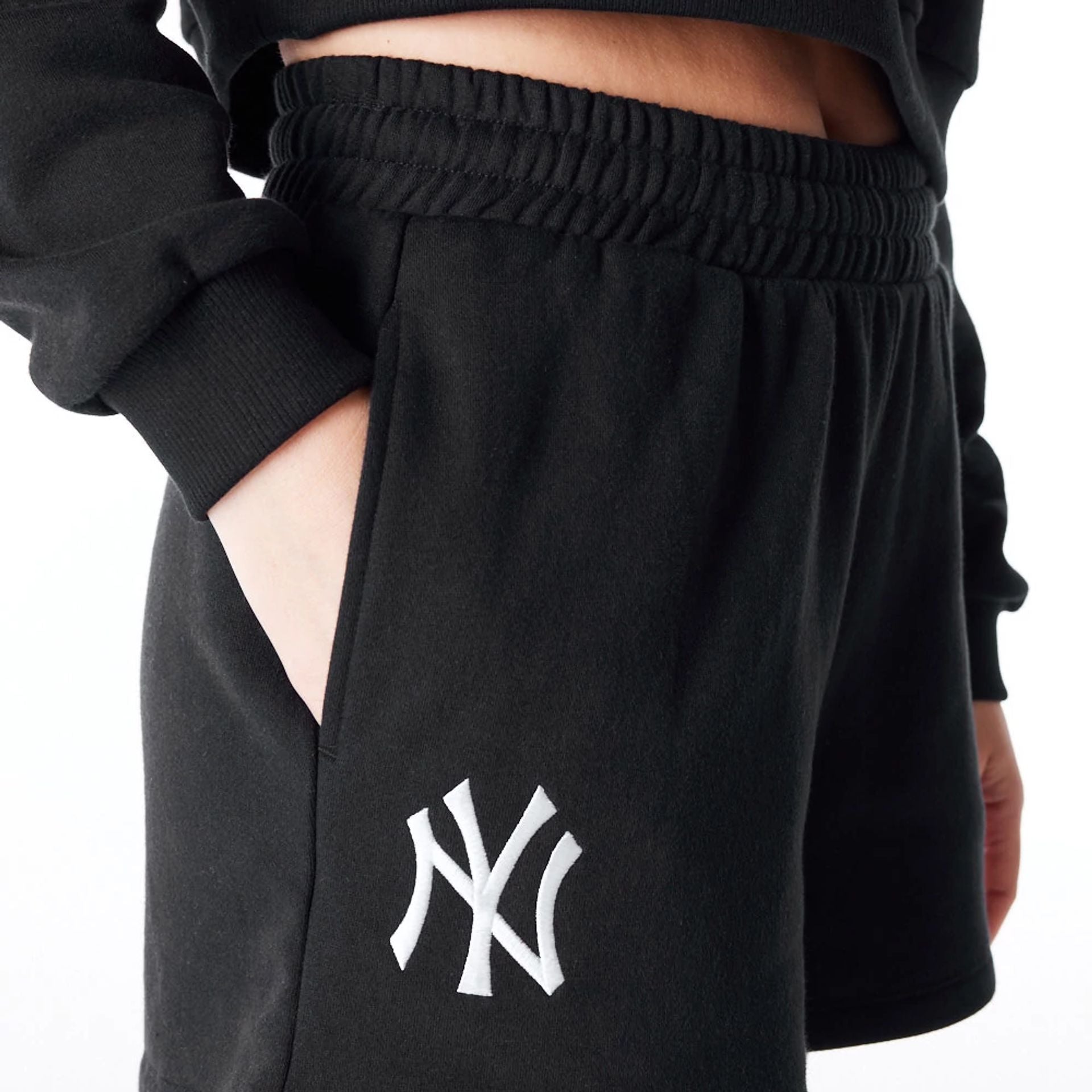 The Female model is wearing New York Yankees Womens MLB League Essential Black Shorts 5