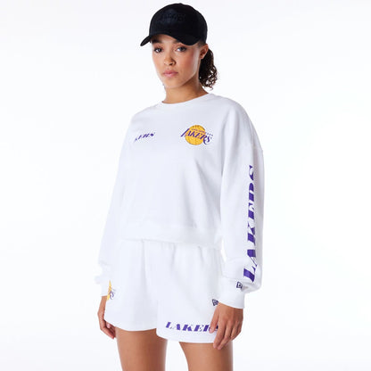 The Female model is wearing LA Lakers Womens NBA Wordmark White Crop Crew Neck Sweatshirt 1