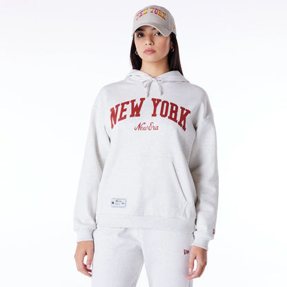 The Female model is wearing New Era Infill Grey Oversized Pullover Hoodie 1